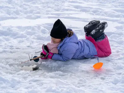 Young girl ice fishing 