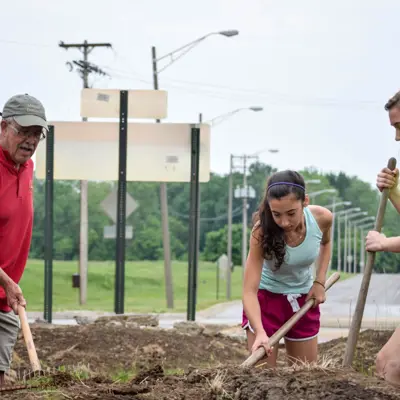 Volunteers gardening at the Park Lake Road roundabout