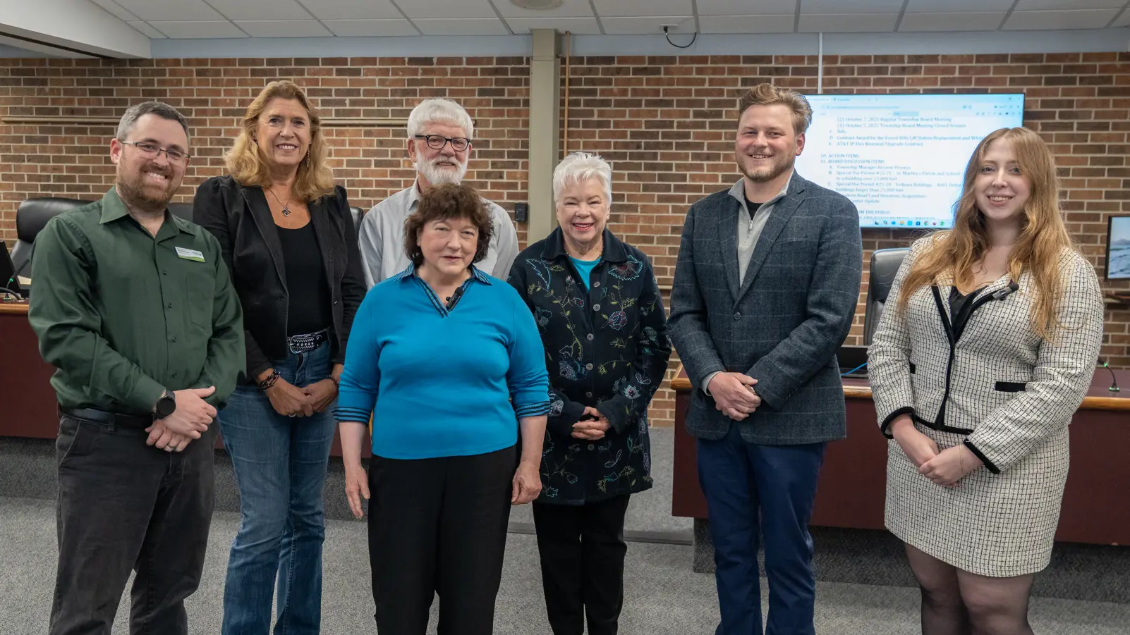 Group photo of the Meridian Township Board members in the Town Hall Room
